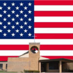 image of American flag behind church building